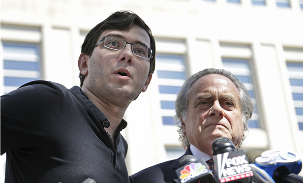 Martin Shkreli, left, and his attorney Benjamin Brafman talk with reporters after leaving federal court in Brooklyn on Friday.